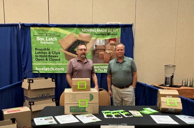 Box Latch - Picture of Jack and Erik standing behind table at Box Latch's booth at the AZSA Trade show